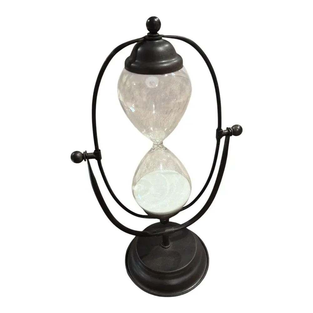 Decorative hourglass on a rotating metal base